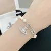 Valda Westwood Saturn Pins Pearl Armband Pappersklipp hänge med diamanter unik kändis samma stil