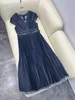 Denim deep V-neck small sleeve, fashionable twisted pleats, special washing and drawing process, heavy-duty pleated dress