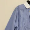 First Tier Brand Counter zieht Frauenkleidung 2023 Frühlings- und Herbst -Blockierende Kurzhüter mit hoher Taillie, locker angemessener Hemd ab