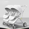Wskaźniki# Nowe bliźniaki wózek dziecięcy Współczesna wchłanianie wstrząsów wielokrotne lekkie składanie SIT i leżące dwukierunkowe powóz dla niemowląt T240509
