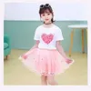 Ensembles de vêtements 2024 NOUVEAUX filles d'été T-shirt Lollipop + jupe tutu 2pcs Childrenns Party Birthday Clothingl2405L24045