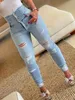Yırtık delikler rahat skinny jeans sonbahar eğik cepler sıkıntılı tek kırpılmış düğme yüksek bel denim pantolon 240423