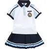 Conjuntos de ropa camisetas de estilo universitario Uniformes de escuela primaria y secundaria Superios de manga corta para niños para niñas British British