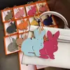 Keychains Lanyards Fashion Real Leather Two Side Rabbit Hanger Sac Keychain Sac à dos Pendante Prouve des Ornements J240509 J240509