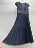 Denim deep V-neck small sleeve, fashionable twisted pleats, special washing and drawing process, heavy-duty pleated dress