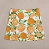 Faldas Patrón de fruta de naranja Mini falda Corea Modesta para mujeres Vestido de verano para mujeres