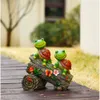 Wogoon Turtle Figurines Outdoor Decoraties, zonne -aangedreven zoete kikker gezicht schildpaddenhars standbeeld met 4 LED -lichten, tuinkunst lente herfst winter kerstdecor