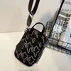 Crossbody feminino de moda novo nylon à prova d'água versátil e compacto saco de ombro pequeno, bolsa de celular casual 80% de fábrica por atacado