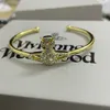 Дизайнер Вествуд сияет, полный бриллиантов, сатурн открытый браслет, набор темперамента женского пола с классическим гвоздом