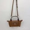 Luxo Bolsa Designer Bag Fa Bun Mini Bolsa Bolsa de Bolsa de Bolsa de Bolsa de Bolsa de ombro único com alça de ombro feminino Bagwfjy