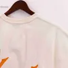 2024 Trende Designer Summer Fashion Trends International Rhude Nouvelle collection Orange Letter Imprimée T-shirt simple et élégant Mentille Loose Femmes Femmes Cornifères