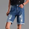 Kvinnors shorts Jean för kvinnor hög midja trendig avslappnad nödläge