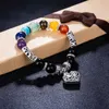 Charm Bracelets Hot Sale Men Women 10mm Bracelets 7 Chakra Healing Balance Beads Heart Charm Bracelet For Female Reiki Prayer Stones Jewelry Y240510