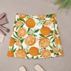 Faldas Patrón de fruta de naranja Mini falda Corea Modesta para mujeres Vestido de verano para mujeres