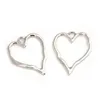 25pcs cor de prata 37x29mm Charms de coração oco para amor para joias de liga de metal artesanal DIY feitas 240507