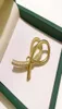 Fashion Men Women Universe pins Yellow Gold Plated Bling CZ Bow Broches Pins For Men Women Suite Dress Rapel Pins2989621