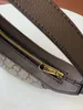 Axelväska designer kvinnor mini crossbody väska lyxhandväskor tote shell väska lather klassiker messenger väskor handväska högkvalitativa sadelväskor 658551