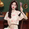 Blans pour femmes en 2024 Blouse d'été en mousseline de mousseline de mode Avancé Tempérament chinois Tops Impression de chemise à manches courtes
