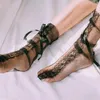 Femmes chaussettes sexy bassages bandage croix ruban de genou de la fête des dames en nylon élastique fishnet meesh creux de créateur socle longue chaussette