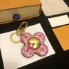 Keilleur de concepteur Keychain Multi-couleur Luxury Keychain Femelle Femelle Male Brown En cuir Purse Lonyard Gold Plated Accessories Caracchette porte-clés avec lettres TOP109