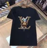 T-shirt de créateur de taille asiatique T-shirt T-shirt MMS T-shirt avec imprimé monogrammé Top à manches courtes à vendre Clothing Hip Hop Luxury Hop Hop Quality Nmjkolp
