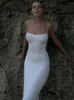 Élégant tricoté longue robe blanche Femmes Spaghetti Spaghetti Backless Bodycon Maxi Robe à lacets Slit Robe Party Tenues 240424