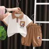 Zestawy odzieży 2024 Baby Letni ubrania dla dzieci chłopiec mody kreskówek pies flip kołnierz krótkie rękawie i szorty chłopców butikowy strój