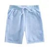 Shorts 2024 Summer Boys and Girls Shorts Solid Color Childrens Elastic Waist Beach Shorts Sports Pants Preschool Clothing d240510