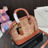 High quality designer bag Woman luxury Shell bag handbag Gold label logo Zipper opening and closing Built-in buckle bag Cow leather Shoulder bag Crossbody bag