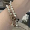 Charm av hög kvalitet Westwood Aleksa Baroque Pearl Armband Version Saturn