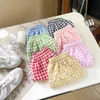 Shorts Korean style 2024 new childrens boys and girls shorts 2-7Y summer unisex anti mosquito childrens casual loose checkered shorts d240510