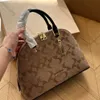 High quality designer bag Woman luxury Shell bag handbag Gold label logo Zipper opening and closing Built-in buckle bag Cow leather Shoulder bag Crossbody bag