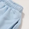 2024 American Fashion Brand Hell Mud Print Laving água para fazer shorts casuais soltos velhos para homens e mulheres