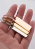 Keychains Doreen Box RVS Keychain RECTANGE RECTANGE BLANC SIMPLES S BLA GOLD COULEUR 65 mm x 25 mm, 1 pièce4930717