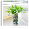 装飾的な花人工緑の植物偽りのユリ谷の花の結婚式のセンターピース