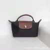 Tasarımcı Çanta Mağazaları Yüksek Versiyonlu% 95 İndirim French Dragon Xiang Mini Delme Omuz Kayışı Hamblesi Modaya Dönüş Modeli Cep Telefonu Sıfır Cüzdan Bir Crossbody Handbag45qu