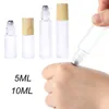 Garrafas de armazenamento 10pcs 5ml 10ml Roll em frascos de amostra de garrafa Os frascos de óleo essencial com rolo grosso de vidro fosco de vidro de vidro cosmético recipiente