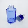 Bouteilles de rangement 100pcs verre 30 ml vide à vendre 30 ml bouteille de compte-gouttes huile essentielle bleue en gros