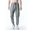 Pantalon masculin d'été hommes luxe petit extensible or imprimé imprimé tendance mode de mode.