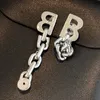 Projektowanie kolczyków dla kobiet 18K złoty sproszkowane kolczyki moda litera metalowa łańcuch kolczyki upuść mężczyzn modne eleganckie prezenty biżuterii