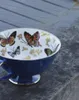 Tazze di piattino europei di lusso di lusso di lusso tazza inglese pomeriggio osso cinese farfalla bordo oro set ceramico in ceramica e