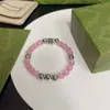 Designer perlé Le nouveau bracelet rose dispose d'un bracelet de conception unique personnalisé et peut être porté par les hommes et les femmes en tant que bracelet à la mode