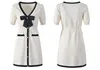 Summer White Plaid Ribbon Tie Bowknot Dress Kort ärm V-hals knappar Knälängd Casual klänningar Y4W09233001