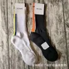 Chaussettes masculines poutres léger luxe couleur unie en caoutchouc haut en caoutchouc joint skateboard à tube haut coton chaussettes pour hommes et femmes serviette au fond des chaussettes INS humides 9x69