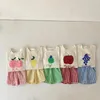 Enfants d'été Impression de fruits en coton mignon de loisirs porte des garçons et filles à manches courtes t-shirts beige et shorts à carreaux ensembles de vêtements 240507