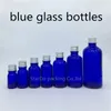 Bouteilles de rangement 5 ml 10 ml 15 ml 20ml 30 ml 50 ml Huile de bouteille en verre bleu 100 ml avec parfum de couverture en aluminium 200pcs / lot