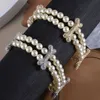 Geselecteerd Westwood vol met diamantbeenderen dubbele laag parelarmband nobele elegante zoete en coole schat high-end versie nagel