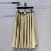 SKIRTSSKORTS Brand deigner Nanyou Gaoding 2024 printemps / été Nouveau arrière Metal Micro Label Age réductrice polyvalente grande jupe Hémorcher le parapluie Half O9BB