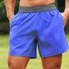 2024 Designer Men Yoga Sports Shorts secs à sec rapidement avec un téléphone mobile de poche back