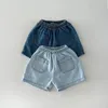 2024 Baby Solid Denim Set Set Set Boys and Girls Denim Shirts and Shorts Two Piece Set Is Simple Casual Sportswear 2PCS 240511